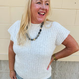 Cream short sleeve knit top with raised tonal stripe texture