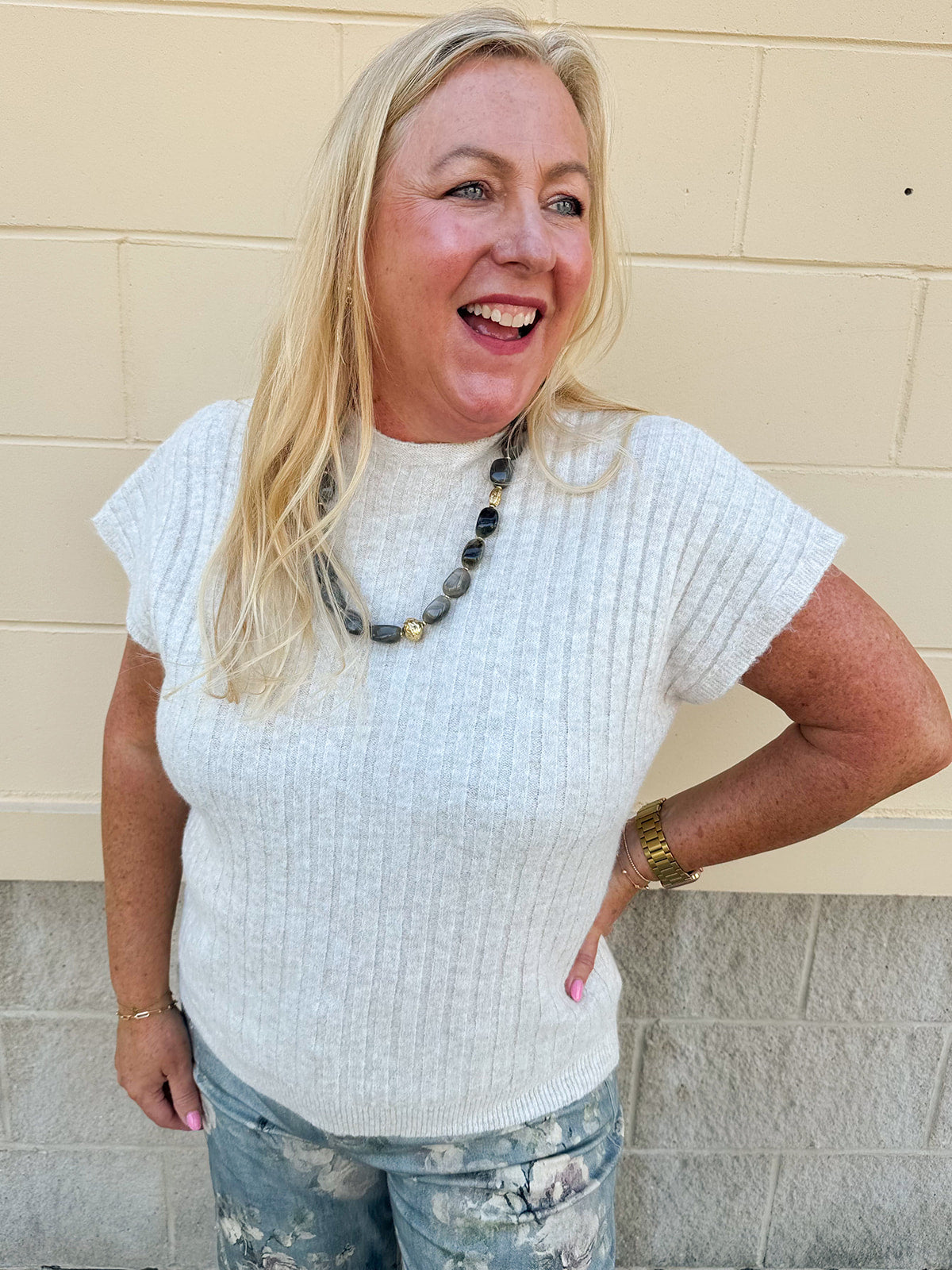 Cream short sleeve knit top with raised tonal stripe texture