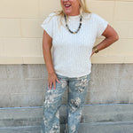 Cream short sleeve knit top with raised tonal stripe texture