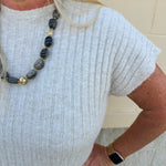 Cream short sleeve knit top with raised tonal stripe texture