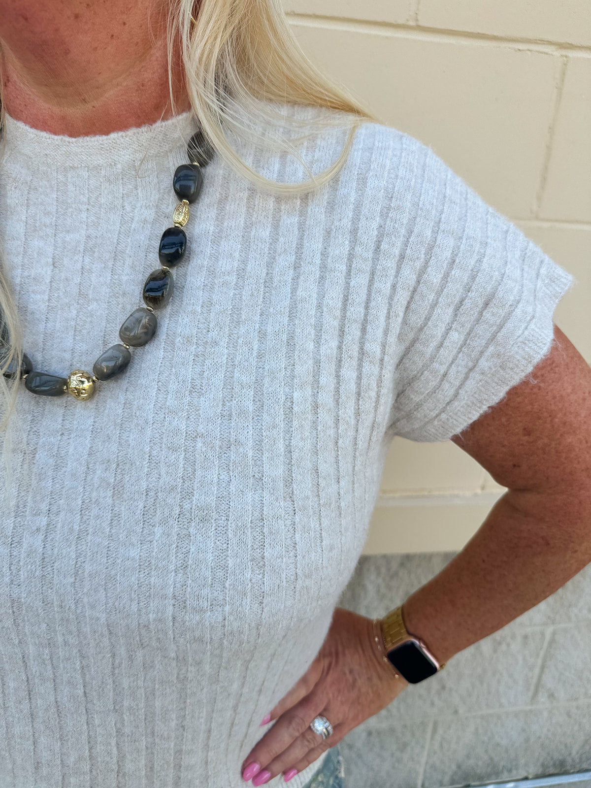Cream short sleeve knit top with raised tonal stripe texture