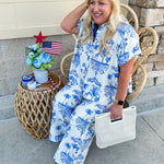 Crystal wearing the Feeling Chic Relaxed Fit Button Down Top – a lightweight, collared v-neck blouse with a button-down front and relaxed fit – styled for a casual summer outing.
