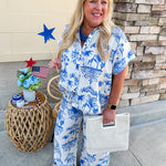 Crystal wearing the Feeling Chic Relaxed Fit Button Down Top – a lightweight, collared v-neck blouse with a button-down front and relaxed fit – styled for a casual summer outing.