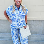 Crystal wearing the Feeling Chic Relaxed Fit Button Down Top – a lightweight, collared v-neck blouse with a button-down front and relaxed fit – styled for a casual summer outing.