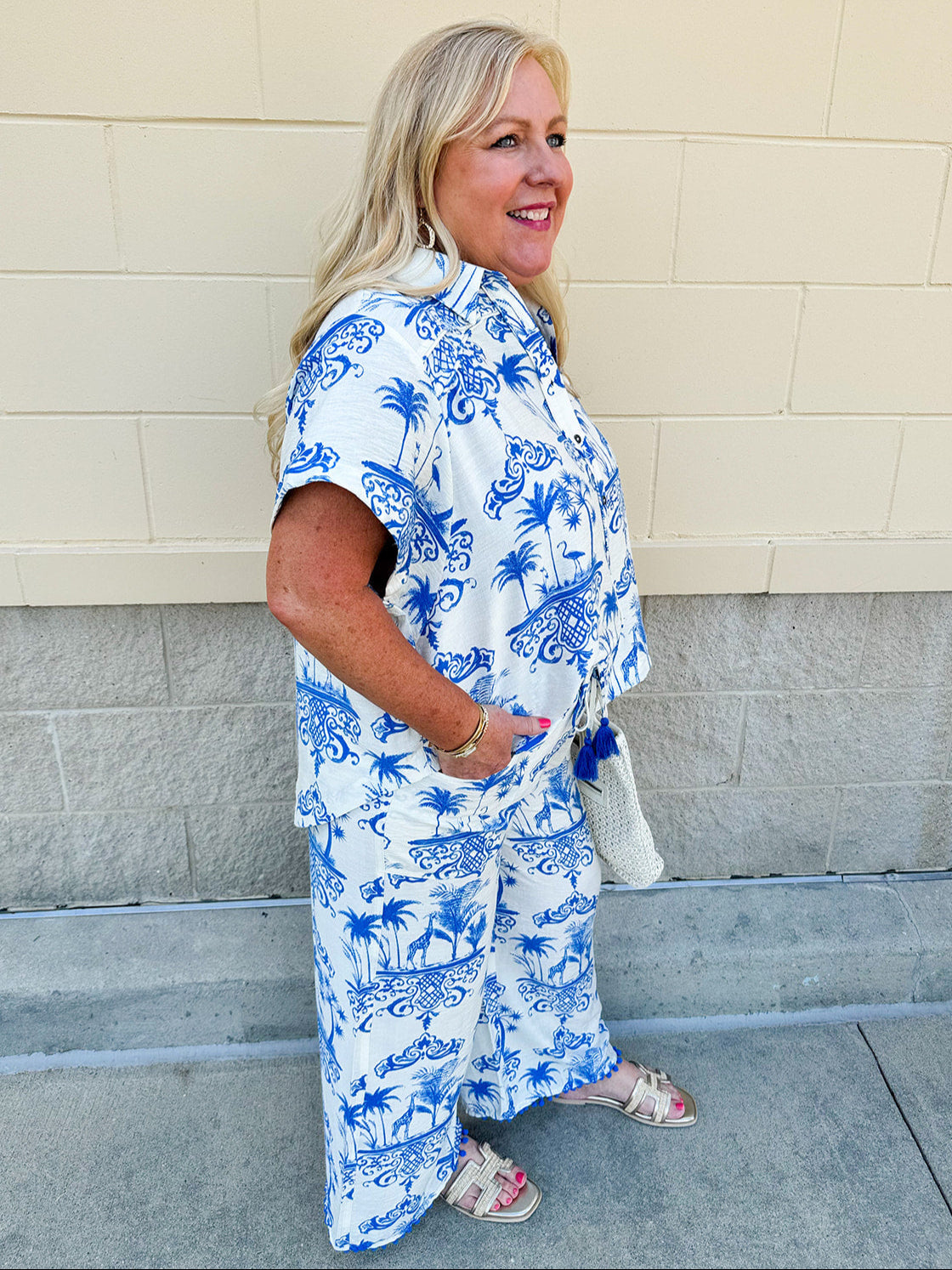 Crystal wearing the Feeling Chic Relaxed Fit Button Down Top – a lightweight, collared v-neck blouse with a button-down front and relaxed fit – styled for a casual summer outing.