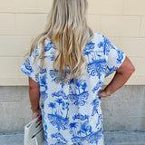Crystal wearing the Feeling Chic Relaxed Fit Button Down Top – a lightweight, collared v-neck blouse with a button-down front and relaxed fit – styled for a casual summer outing.