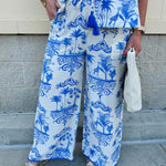 Crystal wearing the Feeling Chic Tassel Tie and Pom Pom Trim Pants – relaxed fit pants with a tassel drawstring waist and playful pom-pom trim, styled for a fun and effortless daytime look