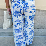 Crystal wearing the Feeling Chic Tassel Tie and Pom Pom Trim Pants – relaxed fit pants with a tassel drawstring waist and playful pom-pom trim, styled for a fun and effortless daytime look