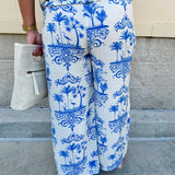 Crystal wearing the Feeling Chic Tassel Tie and Pom Pom Trim Pants – relaxed fit pants with a tassel drawstring waist and playful pom-pom trim, styled for a fun and effortless daytime look