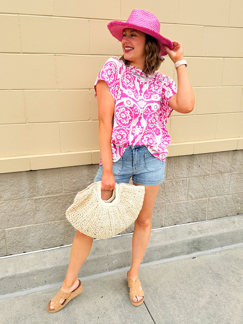 Pink and white blouse with lace-trim neckline and batwing sleeves, styled for a soft, feminine look.