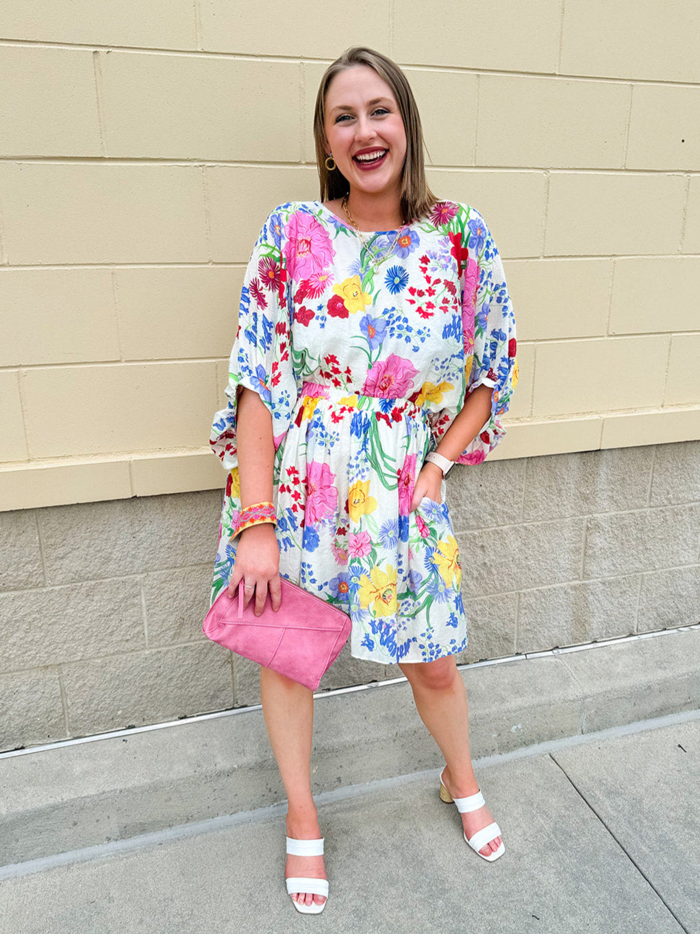 Floral mini dress with dolman sleeves and elastic waist in a lightweight, breezy fabric—perfect for warm weather days.