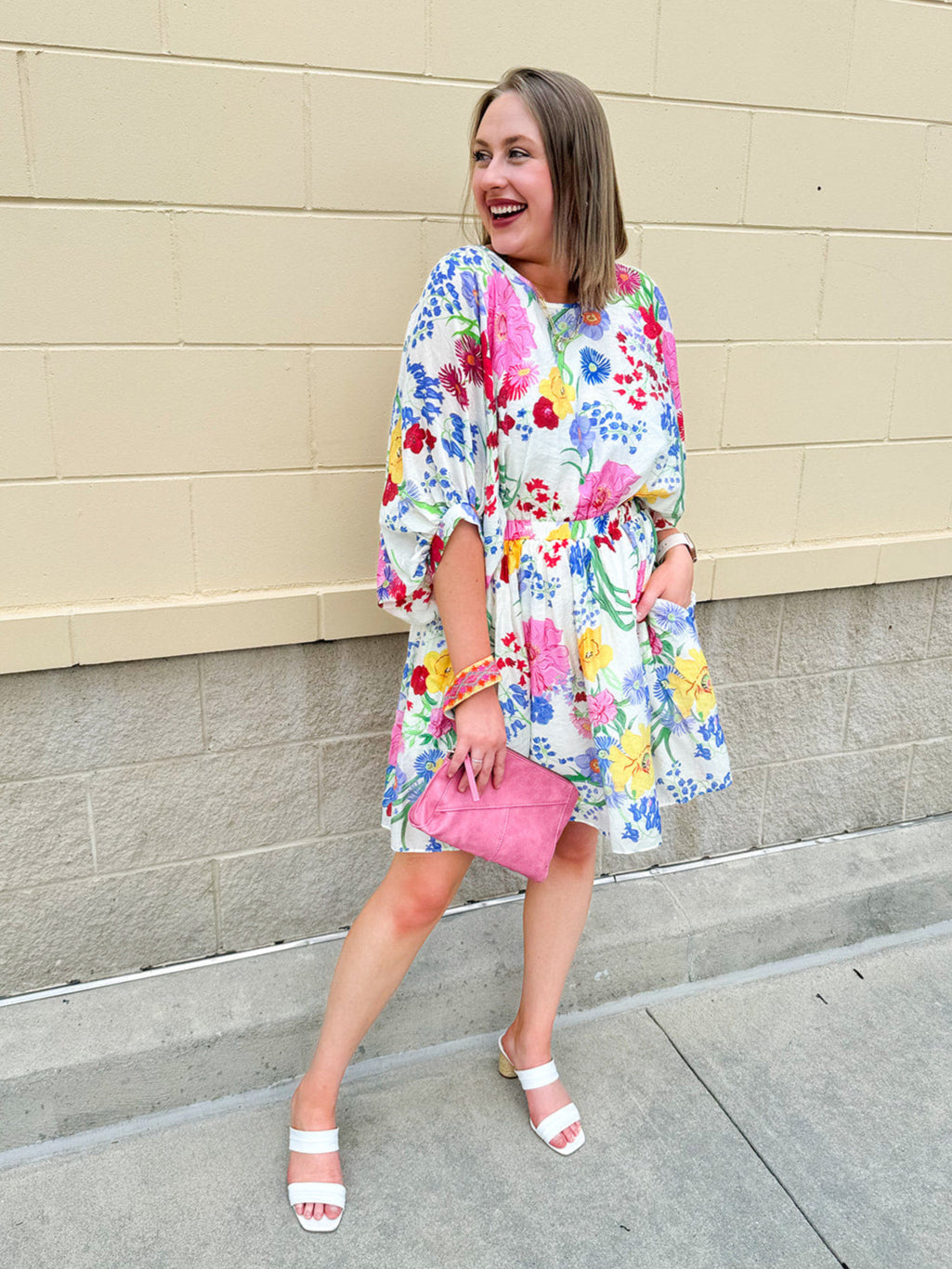 Floral mini dress with dolman sleeves and elastic waist in a lightweight, breezy fabric—perfect for warm weather days.
