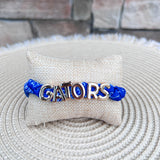Florida Gators adjustable bandana slider bracelet featuring a bandana-print fabric band with gold Florida Gators letter charms.
