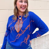 Blue merino wool blend Florida Gators script sweater featuring chain stitch embroidered hand-drawn collegiate artwork.