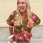 Olive floral button-down blouse with pink and orange flowers, V-neckline, and cream fringe trim on sleeves.