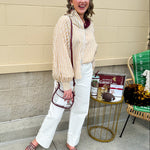 Clear crossbody stadium bag with garnet straps and gold hardware, perfect for stylish game day looks.