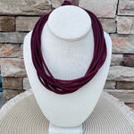 Thin garnet rope necklace with ball-and-eye closure