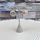 Georgia Bulldogs pearl and bow statement earrings featuring gold bows, pearl-accented medallions, and the Georgia Bulldogs logo.