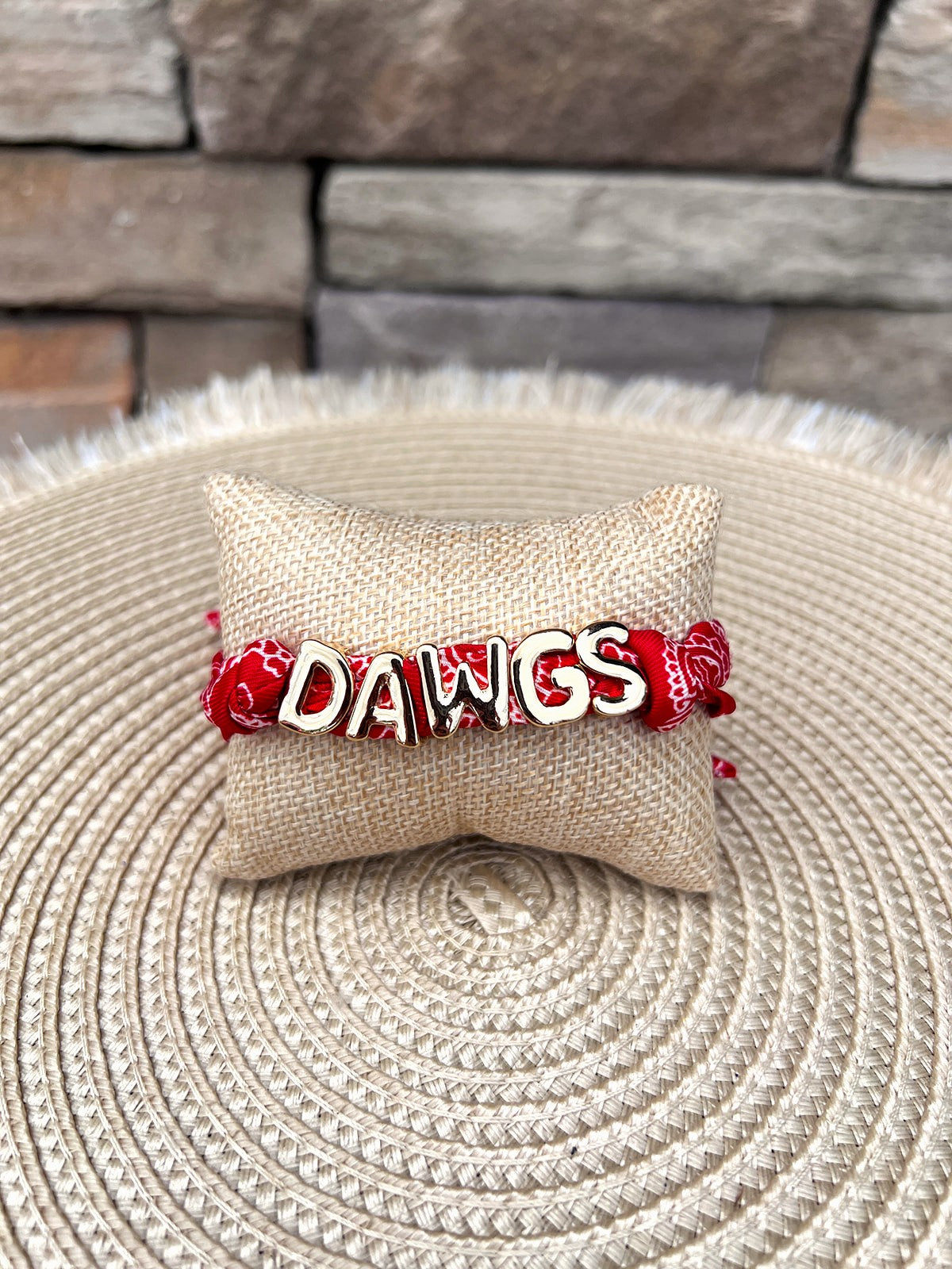 Georgia Bulldogs adjustable bandana slider bracelet featuring a red printed fabric band with gold letter charms.