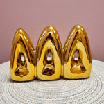 Gold Delta Delta Delta bubble letter shelf décor with a polished metallic finish.