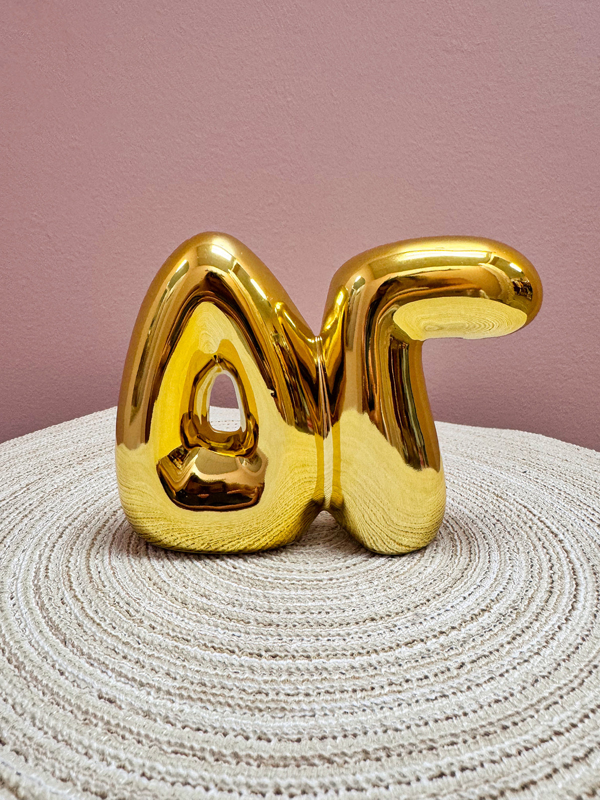 Gold Delta Gamma bubble letter shelf décor with a polished metallic finish.