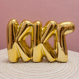 Gold Kappa Kappa Gamma bubble letter shelf décor with a polished metallic finish.