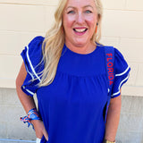 Royal blue woven top with round neckline, ruffle sleeves, and flowy relaxed silhouette.