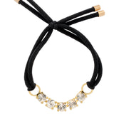 Gold-tone elastic hair tie with a row of shimmering round-cut crystals