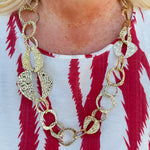 Hammered Metal Statement Necklace featuring organically shaped, textured metal accents on a 28-inch adjustable chain