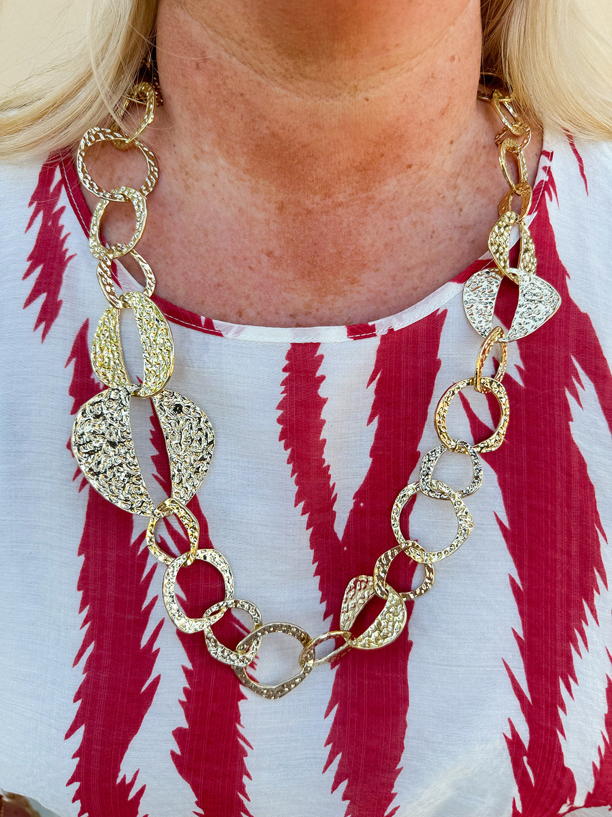 Hammered Metal Statement Necklace featuring organically shaped, textured metal accents on a 28-inch adjustable chain