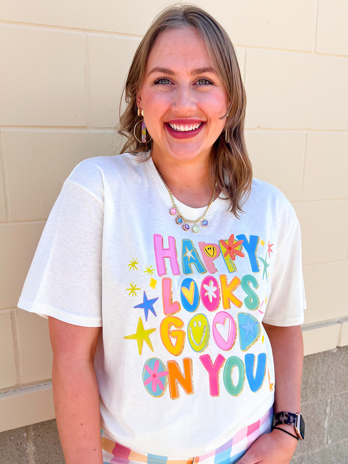 Cream graphic t-shirt with colorful Happy Looks Good On You design