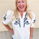Ivory short sleeve top with navy embroidered floral detailing