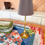  Harlow Brass Table Lamp with brass-finish base and taupe pleated shade, featuring cordless rechargeable LED lighting and touch control.