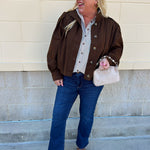 Hazelnut brown jacket with five front buttons, shoulder button accents, and a versatile high neckline