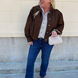 Hazelnut brown jacket with five front buttons, shoulder button accents, and a versatile high neckline
