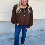 Hazelnut brown jacket with five front buttons, shoulder button accents, and a versatile high neckline