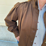 Hazelnut brown jacket with five front buttons, shoulder button accents, and a versatile high neckline