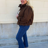 Hazelnut brown jacket with five front buttons, shoulder button accents, and a versatile high neckline