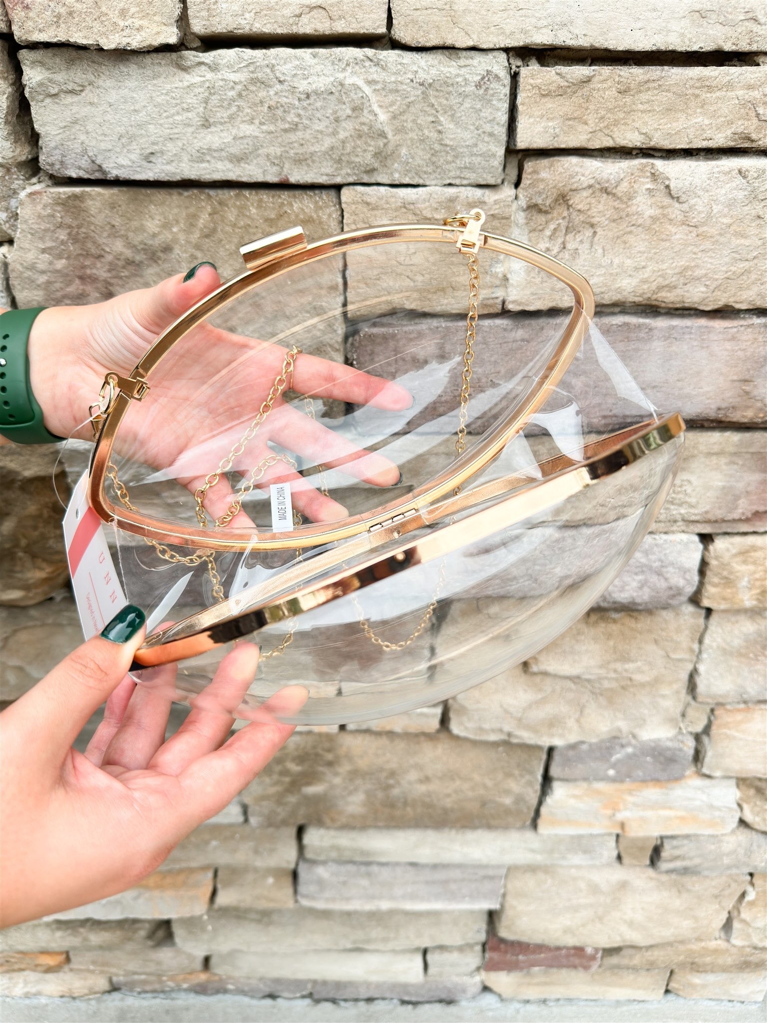 Clear Football shaped Stadium Purse with gold chain.