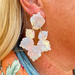 Long iridescent statement earrings with blue, mint, pink, and purple tones, inspired by seashells and crafted from eco-friendly materials