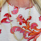 Bright gold long paperclip chain necklace with bold links and a versatile, layerable length