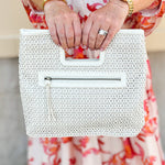 "Joy Susan Rio Faux Cane Cutout Handle Tote Bag displayed with its structured silhouette, faux cane cutout handles, and sleek vegan leather finish – styled as a versatile accessory for everyday or travel use."