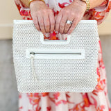 "Joy Susan Rio Faux Cane Cutout Handle Tote Bag displayed with its structured silhouette, faux cane cutout handles, and sleek vegan leather finish – styled as a versatile accessory for everyday or travel use."