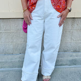 Vanilla-colored cuffed straight-leg jeans made from organic cotton; high-rise fit with luxe, eco-conscious boutique style.