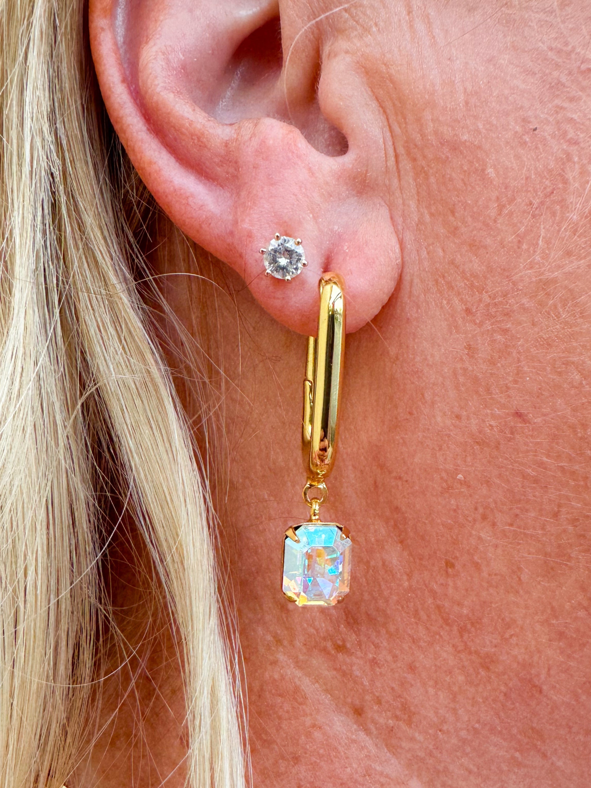 Bright gold-tone rectangle hoop earrings with dangling emerald-cut Aurora Borealis crystals from Sorrelli’s Crystal Aurora Borealis Collection.