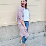 Mauve ruffle duster cardigan with open front and ruffled detailing along sides and sleeves.