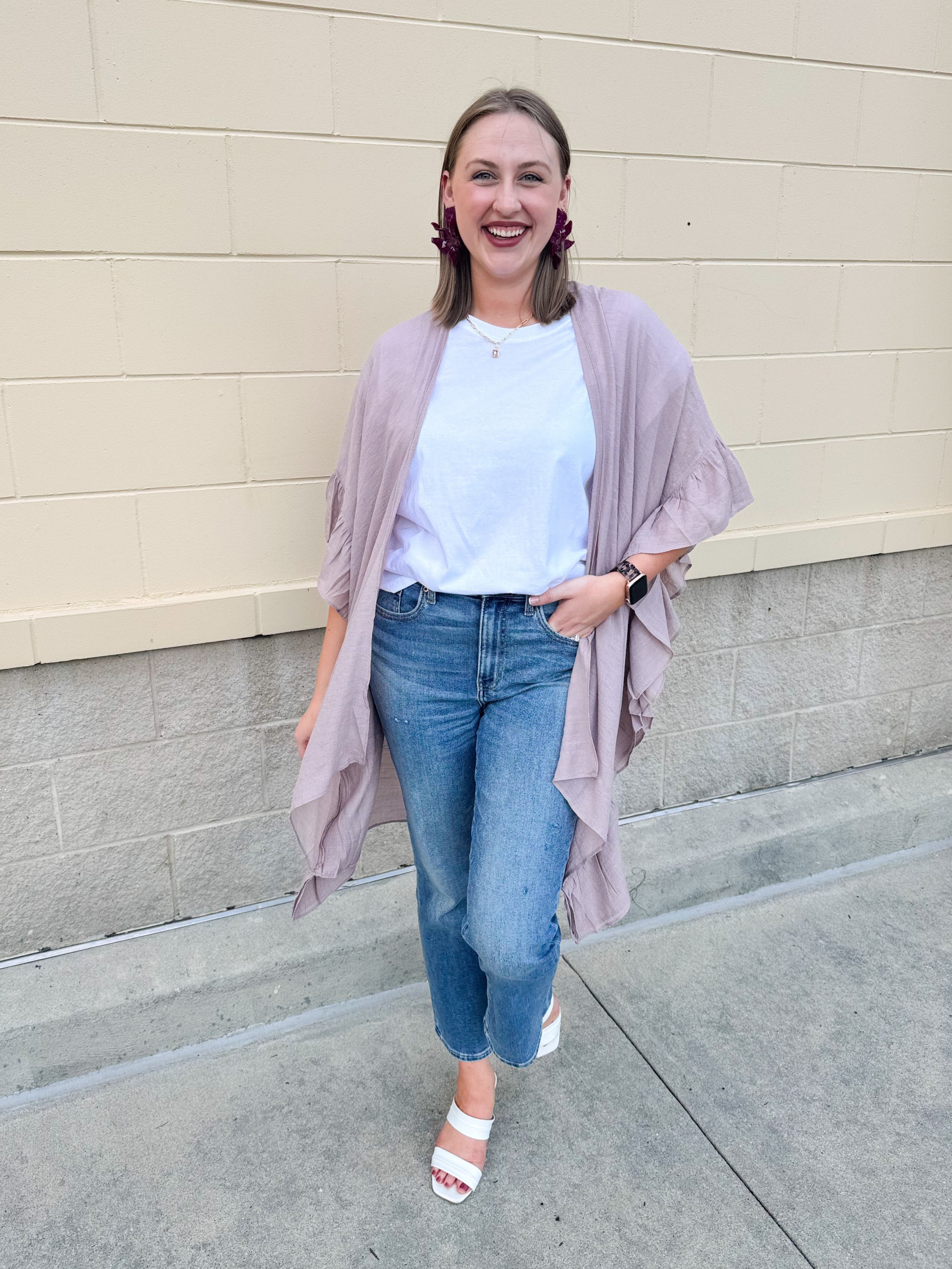 Mauve ruffle duster cardigan with open front and ruffled detailing along sides and sleeves.