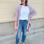 Mauve ruffle duster cardigan with open front and ruffled detailing along sides and sleeves.