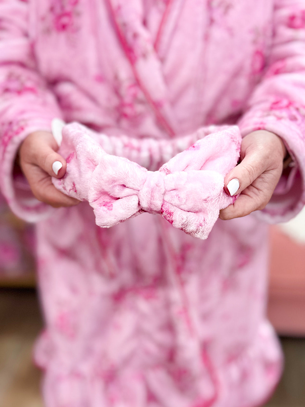 Pink floral spa headband with bow accent