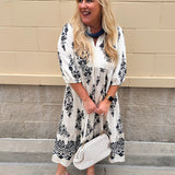 Cream and black abstract print tiered midi dress